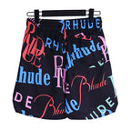 Rhude Black All‑Over Multicolor Logo Shorts
