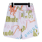 Rhude White All‑Over Multicolor Logo Shorts
